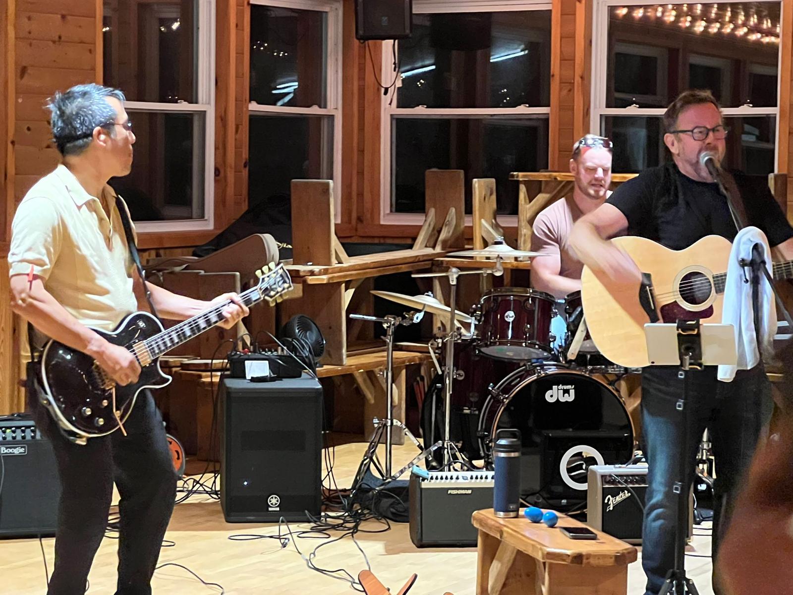 close up of electric guitar being played by musician