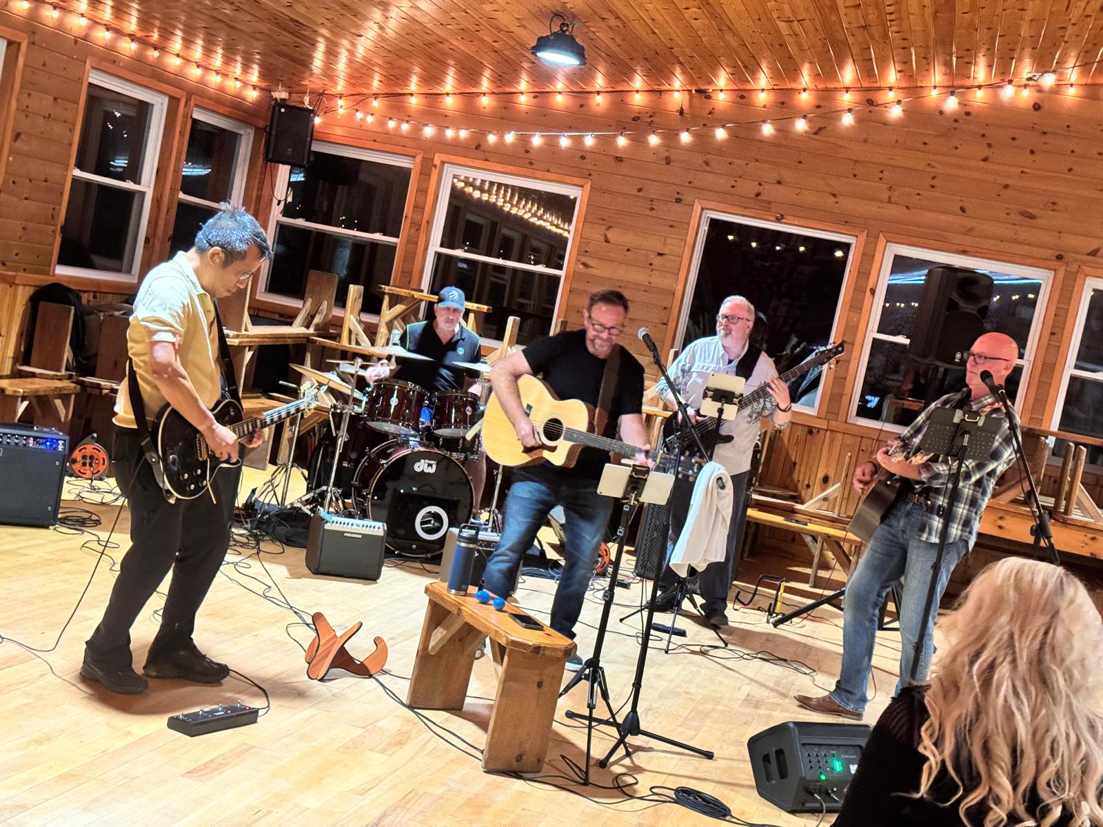 band playing live music at a summer camp party